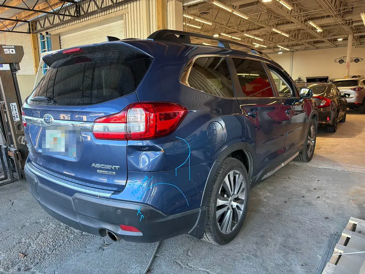 Body damage on a 2021 Subaru Ascent before paint and body restoration